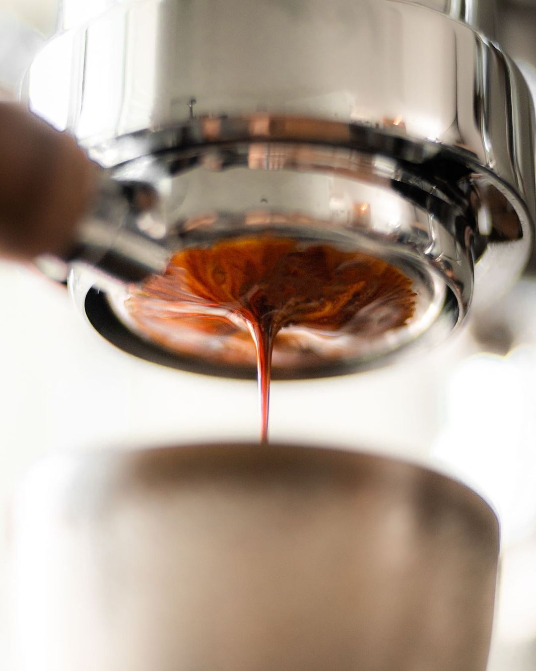 pulling espresso into a cup